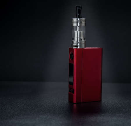 Big electronic cigarettes on black.の写真素材