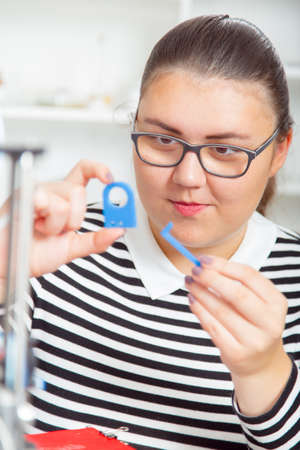 schoolgirl with 3d printe. education