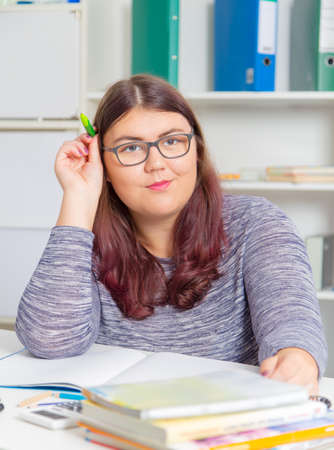 Teenage girl preparing for exams. Teenage girl doing homework for school.の写真素材