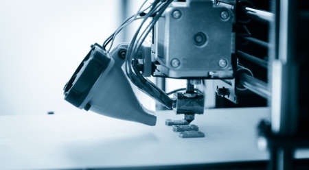 Electronic three dimensional plastic printer during work , 3D printer.の写真素材