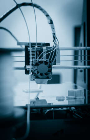 Electronic three dimensional plastic printer during work , 3D printer.の写真素材