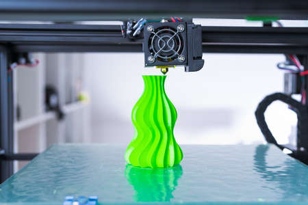 Modern 3D printing.. 3d printer mechanism working during the processes.の写真素材
