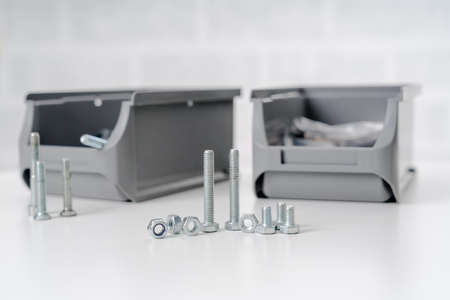 metal screw, bolt and nuts on white background.の写真素材