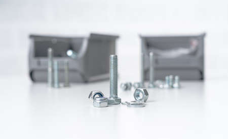 metal screw, bolt and nuts on white background.の写真素材