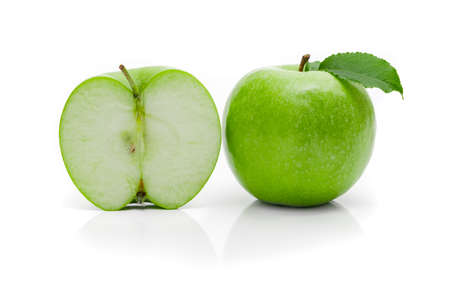 Ripe green apple with leaf on a white background.の写真素材