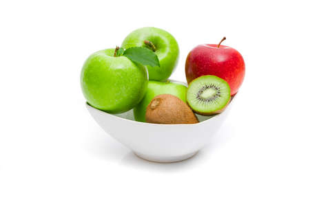Ripe green apple with leaf on a white