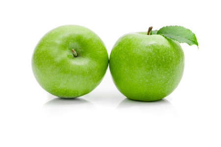 Ripe green apple with leaf on a white background.の写真素材