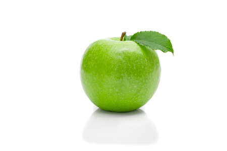 Ripe green apple with leaf on a white background ..の写真素材