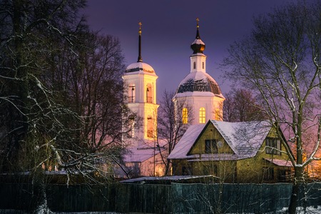 Magic light pouring from the windows of the Church on the eve of Christmas
