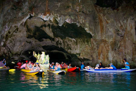 Phuket, Thailand, January 30, 2017: Tourists in boat swim into the cave of the island.のeditorial素材