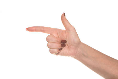 A brush of a female hand shows a symbol. Beautiful and graceful female hand on a white background...