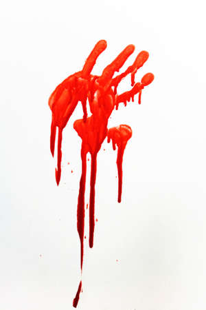 A human handprint stained with blood.の写真素材