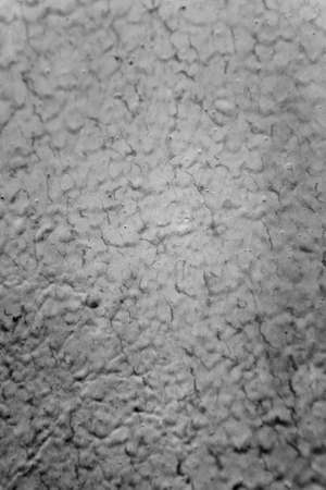 Texture of the streams of gray paint on the wall closeup.の写真素材