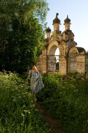The girl is walking along the old abandoned Chernyshev estate. Russia.の写真素材