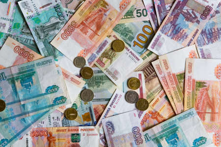 Business. Many monetary denominations of different denominations and coins. Rubles and dollars.の写真素材