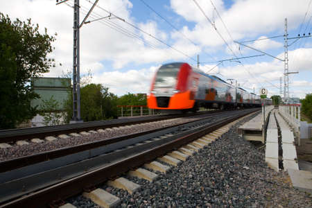 The train quickly travels along the Moscow Central Ring. Motion blur.のeditorial素材