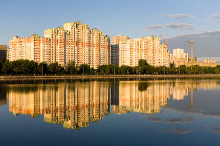 The residential complex is reflected in the Moscow River at dawn.の写真素材
