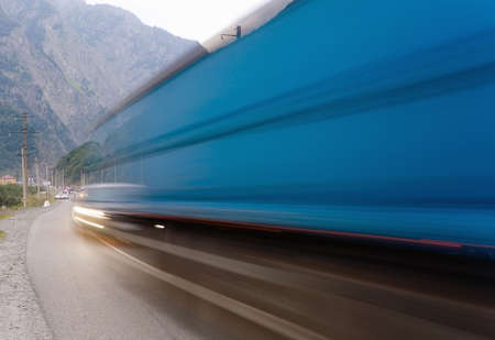 Cars quickly go on the road. Motion blur.の写真素材