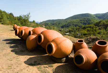 Large clay jugs for wine are put up for sale. Georgia.