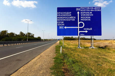 The M4 motorway. A road sign of directions at the junction.