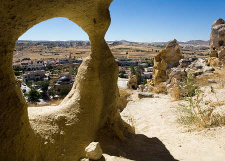 View from the cave to the mosque in Chavushin. Turkey.の写真素材