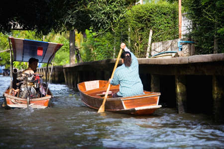 Bangkok, Thailand, May 17, 2013: People sail in boats on the canal.