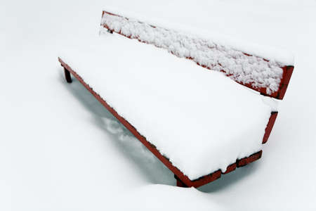 Thick layer of snow on the bench. Winter in Moscow.の写真素材