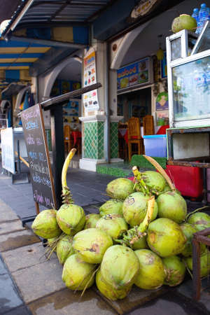 Coconuts are sold on the street. Street trading.