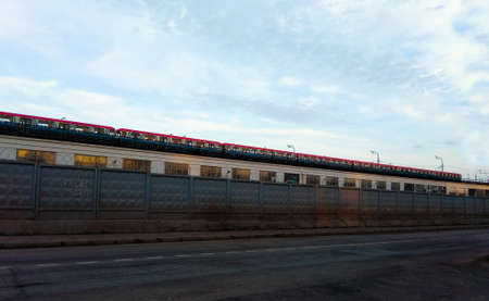 Train of the Moscow metro against the background of the spring sky. Russia.