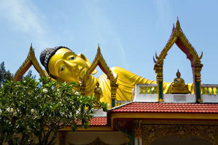 Sculpture of the Great Golden reclining Buddha. Thailand.の写真素材