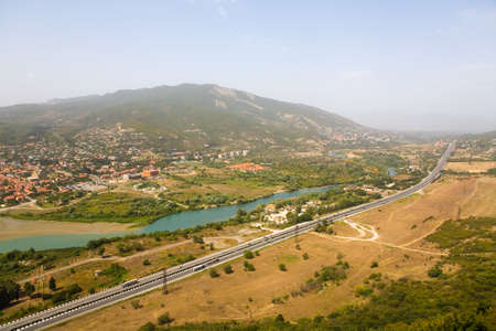 Motorway and river near the town of Mtskheta. Georgia.