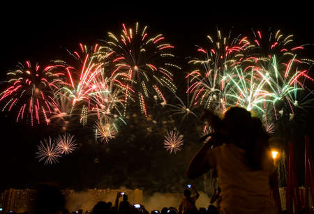 Viewers watch beautiful fireworks in the sky. Moscow.