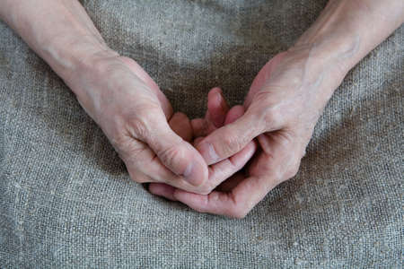 Wrinkled hands of an old woman. Close-up.の写真素材