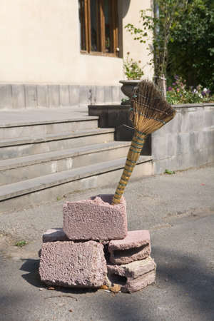 Still life with a broom in the open air. No people.の写真素材