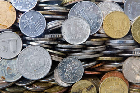A lot of coins of various denominations and different countries. Donations in the Temple of the Big...