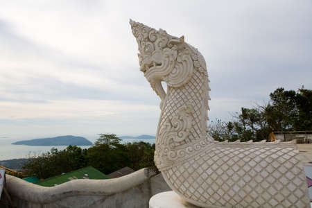 The head of the dragon in front of the entrance to the Temple of the Big Buddha in Phuket Island. Culture of Thailand.の写真素材