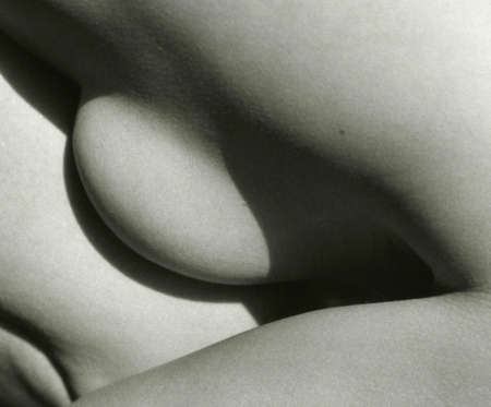 Abstract photo of a part of a female body. Attention! Image contains grit and other artifacts of analog photography!の写真素材