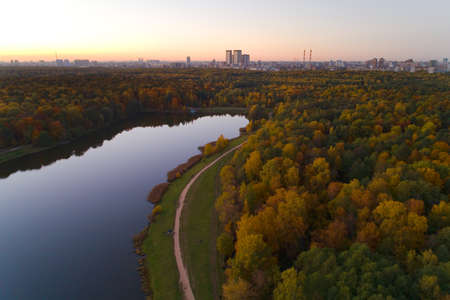 Evening autumn landscape in Izmailovsky park with a pond. Aerial photography.の写真素材