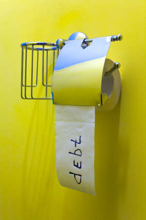 Roll of toilet paper with the inscription in English "Debt". Still life.の写真素材