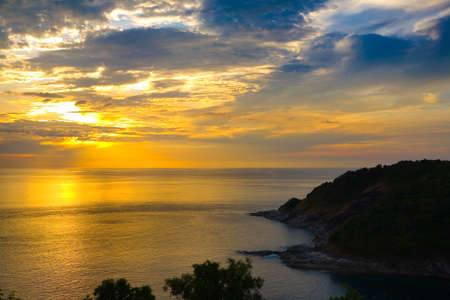 Colorful golden sunset and cloudy sky at the sea. Nature.の写真素材