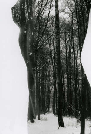 Naked slender girl and winter nature in one frame. Attention! Image contains grit and other artifacts of analog photography!の写真素材