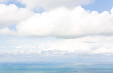 The sky and the sea merge on the horizon into a single whole. Summer daytime seascape.