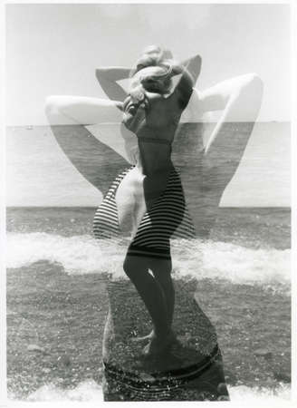 Double multiple exposure: a girl sunbathes on the seashore. Attention! The image contains grain and...