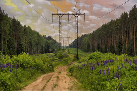 High voltage electric power lines on sky with cloudsの写真素材