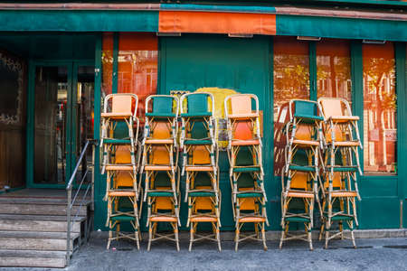 Chairs at cafe are put waiting for openingの写真素材