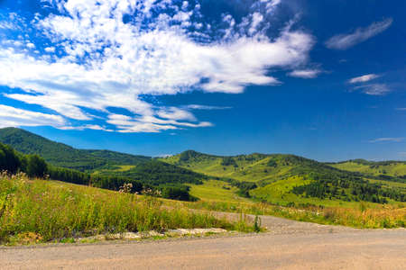 mountain road in the bright summer afternoonの写真素材