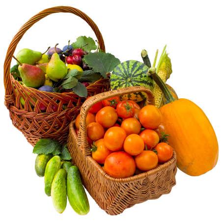 Autumn basket with vegetables and fruit isolated on a white background.の写真素材