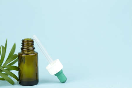 Medical bottles. Brown glass bottles. Medicines, drugs, pills. Brown jars on a blue background. Medicines in a jar.の写真素材