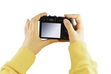 Woman holding a photo camera with empty space. Vacation and travel concept.