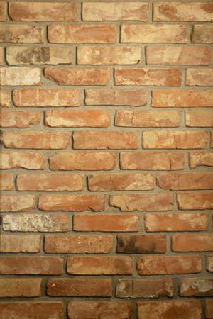 Brick wall. The wall is made of red, old bricks. Vintage background.